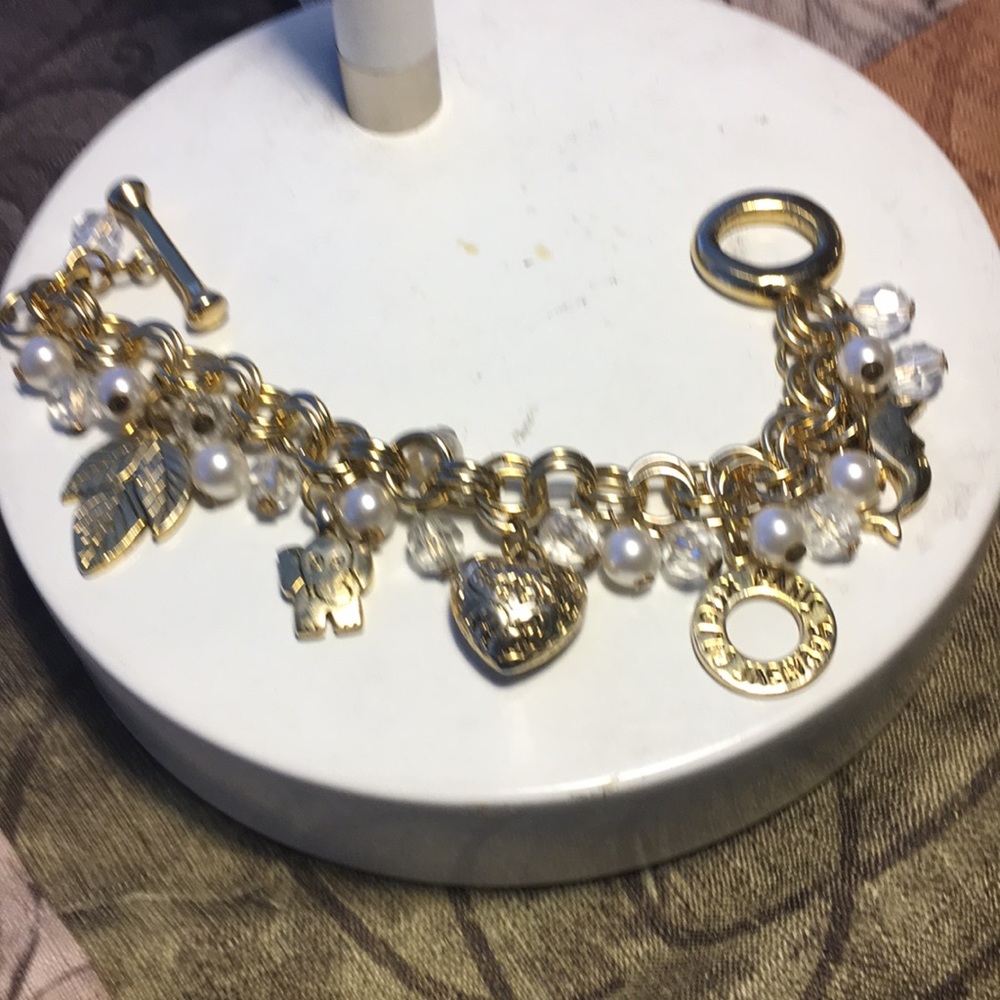 Gold bracelet with pearls & charms